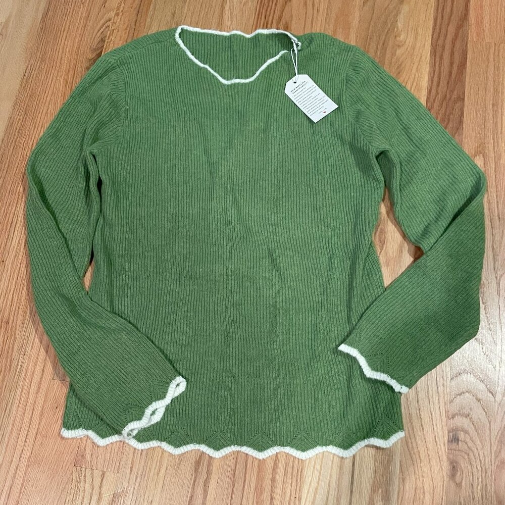 Green sweater with white trim